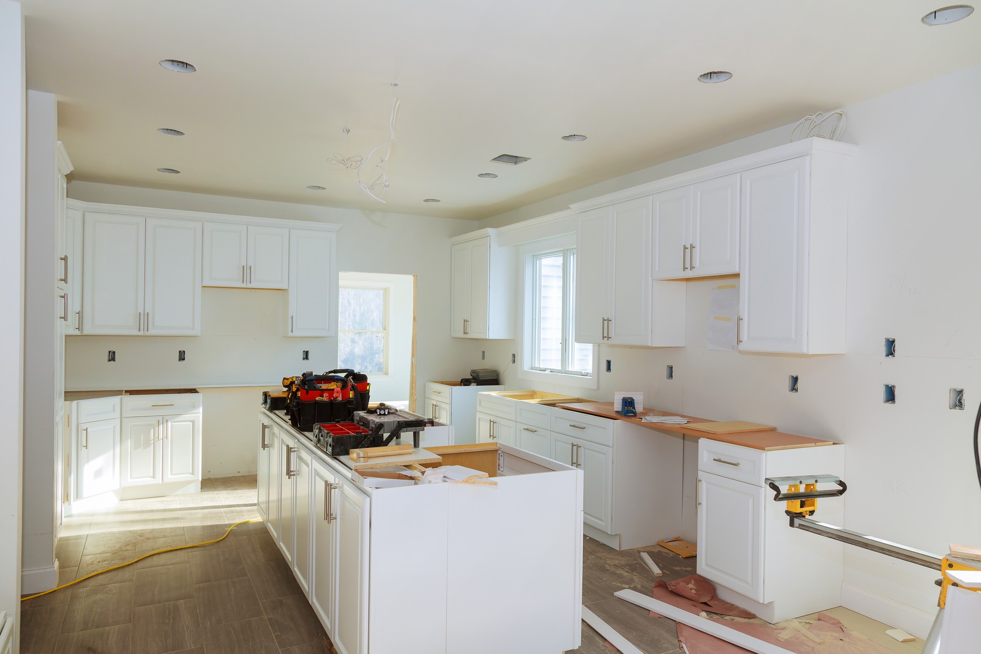 Installing new induction hob in modern kitchen