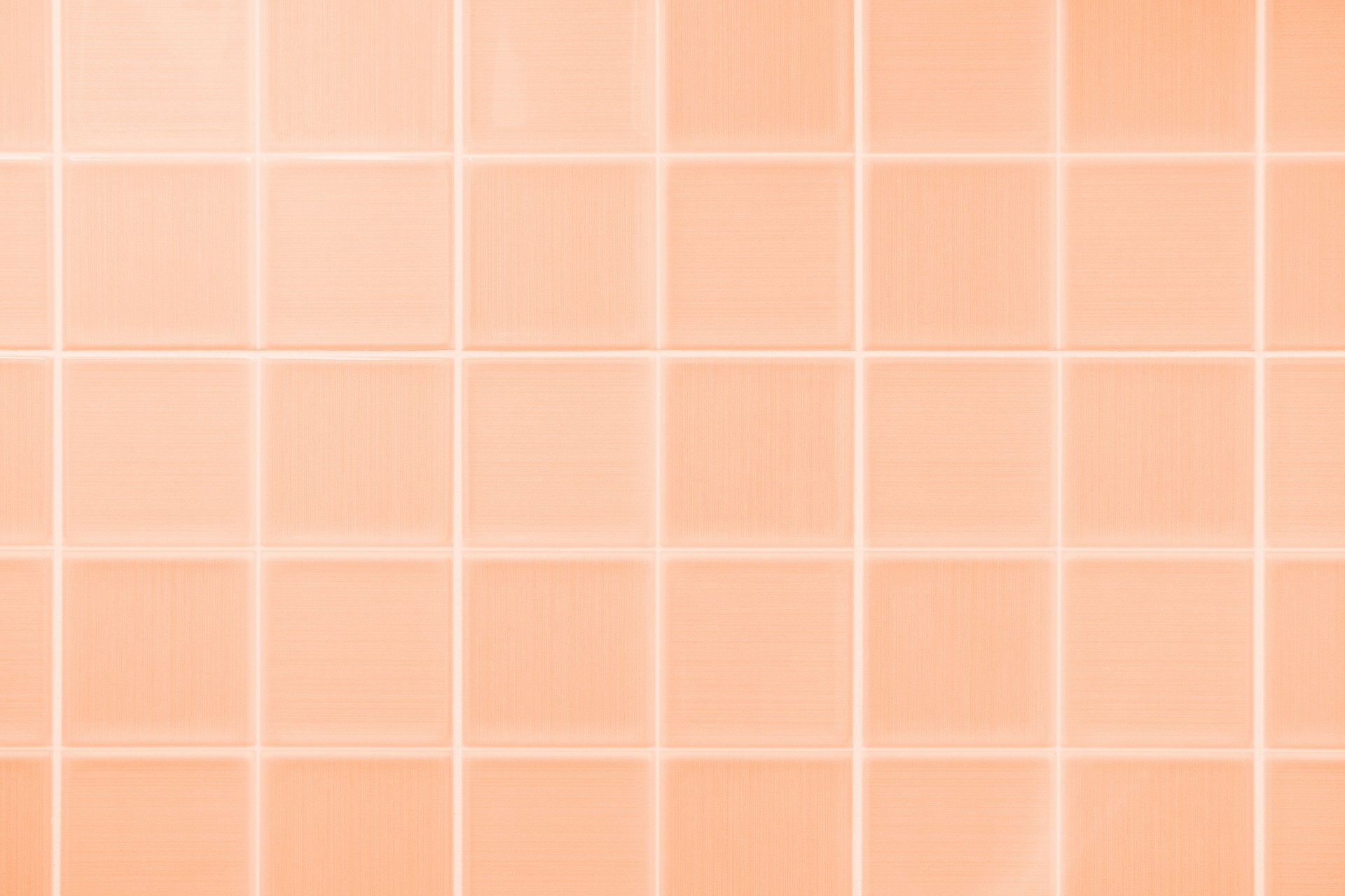 Ceramic tile close-up, texture and abstract background, concept color trend 2024 peach color.