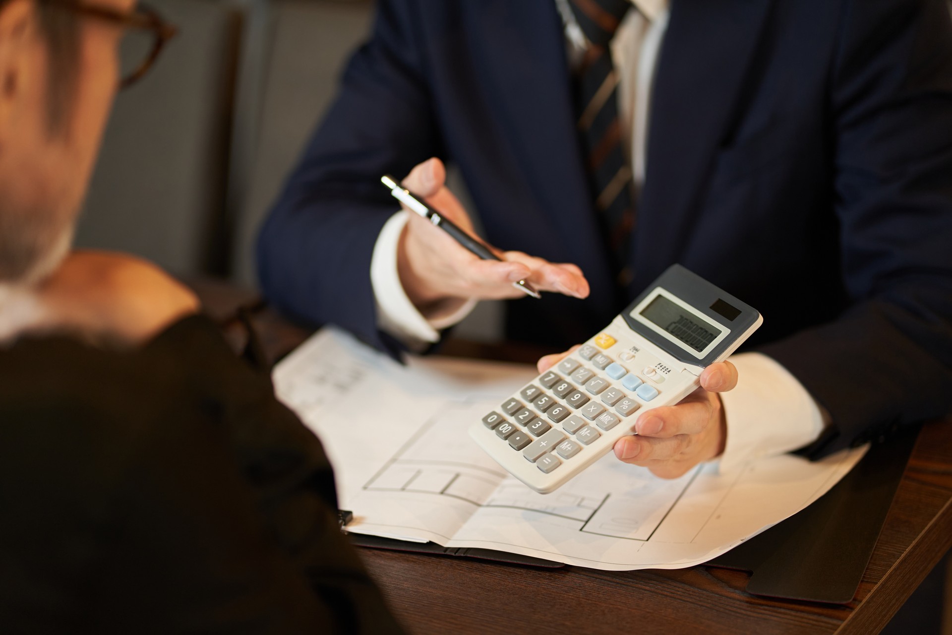 A sales man proposing a restaurant refurbishment plan